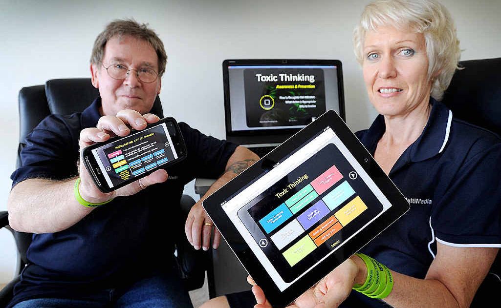 Trevor and Annie Boulton with their Toxic Thinking app. Trevor and Annie Boulton with their Toxic Thinking app.